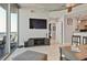 Bright living room features modern furniture, ceiling fan, and access to a private balcony with city views at 3324 Peachtree Rd # 2717, Atlanta, GA 30326
