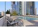Relax by the pool with lounge chairs and city views for an ultimate urban retreat at 3324 Peachtree Rd # 2717, Atlanta, GA 30326