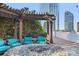 Inviting terrace with outdoor seating, a stone fire pit, and city skyline views at 3324 Peachtree Rd # 2717, Atlanta, GA 30326
