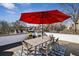 Rooftop deck featuring a dining table with seating and an umbrella for shade, perfect for outdoor meals at 522 Boulevard Ne Pl, Atlanta, GA 30308