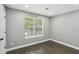 A comfortable bedroom with neutral tones, a window for natural light, and hardwood floors, perfect for relaxation at 63 Fulton Se St, Atlanta, GA 30312