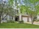 Charming two-story home with well-maintained lawn and attached two car garage, nestled among mature trees at 63 Fulton Se St, Atlanta, GA 30312