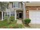 Inviting front entrance with brick accents, well-kept landscaping and an attached one car garage at 63 Fulton Se St, Atlanta, GA 30312