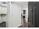 View of the kitchen, hallway, living and dining area with hardwood floors and neutral paint scheme at 63 Fulton Se St, Atlanta, GA 30312