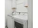 Well-organized laundry room with modern washer and dryer, maximizing efficiency with storage cabinets at 63 Fulton Se St, Atlanta, GA 30312