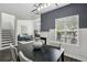 Living area with stairs, dining area, and large window bringing natural light at 63 Fulton Se St, Atlanta, GA 30312
