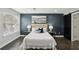 Serene main bedroom features a plush bed, calming wall color, and barn door offering a peaceful retreat at 63 Fulton Se St, Atlanta, GA 30312
