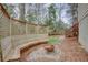 This backyard features a built-in bench and fire pit, ideal for entertaining guests or enjoying quiet evenings at 148 Murray Hill Ne Ave, Atlanta, GA 30317