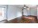 Large bedroom with hardwood floors, ceiling fan, and access to an outdoor deck with railing at 148 Murray Hill Ne Ave, Atlanta, GA 30317