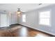 Spacious bedroom with hardwood floors, large windows, and elegant wall sconces at 148 Murray Hill Ne Ave, Atlanta, GA 30317