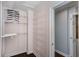 Walk-in closet with shelves and a clothing rack system for optimal organization and storage at 148 Murray Hill Ne Ave, Atlanta, GA 30317