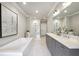 A luxurious bathroom featuring a standalone tub, dual vanities, and a spacious glass-enclosed shower at 3715 Peachtree Ne Rd # 2, Atlanta, GA 30319