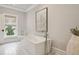 A bright bathroom featuring a sleek soaking tub, elegant fixtures, and natural light for a serene experience at 3715 Peachtree Ne Rd # 2, Atlanta, GA 30319