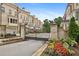 Beautiful entrance to a community with brick facade and black metal gate at 3715 Peachtree Ne Rd # 2, Atlanta, GA 30319