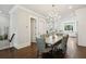 Bright dining room with chandelier and views to the kitchen at 3715 Peachtree Ne Rd # 2, Atlanta, GA 30319