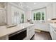 A contemporary kitchen boasting a quartz island, stainless steel appliances, and rich hardwood floors at 3715 Peachtree Ne Rd # 2, Atlanta, GA 30319