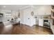 Open-concept living area with hardwood floors, wet bar, beverage fridge, and views of the cozy sitting room at 3715 Peachtree Ne Rd # 2, Atlanta, GA 30319