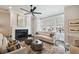Cozy living room with fireplace, neutral palette, stylish decor, and large windows at 3715 Peachtree Ne Rd # 2, Atlanta, GA 30319