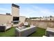 Outdoor rooftop terrace with seating around a fireplace perfect for entertaining and enjoying city views at 3715 Peachtree Ne Rd # 2, Atlanta, GA 30319