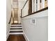 Elegant staircase with white risers, dark wood treads and handrail at 3715 Peachtree Ne Rd # 2, Atlanta, GA 30319
