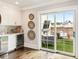 Entertainer's dream wet bar with beverage fridge, white cabinetry, and seamless access to an outdoor terrace at 3715 Peachtree Ne Rd # 2, Atlanta, GA 30319