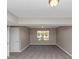 Spacious basement featuring neutral paint, gray carpet and a window with natural light at 5508 Hadrian Ct, Lithonia, GA 30058