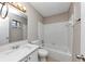 Clean, updated bathroom featuring vanity with sink and combined tub and shower with white tiling at 5508 Hadrian Ct, Lithonia, GA 30058