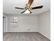 Bedroom with ceiling fan, neutral carpet, and a window at 5508 Hadrian Ct, Lithonia, GA 30058