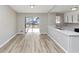 Open kitchen with stainless steel sink, and sliding glass door to deck at 5508 Hadrian Ct, Lithonia, GA 30058