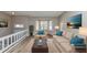 Bright living room features hardwood floors, a bay window, and comfortable seating area at 5508 Hadrian Ct, Lithonia, GA 30058