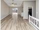 Open living space with hardwood floors and sliding glass door to deck at 5508 Hadrian Ct, Lithonia, GA 30058