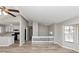 Open-concept living area with hardwood floors, and view into the kitchen at 5508 Hadrian Ct, Lithonia, GA 30058