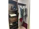 Functional walk-in closet with shelves, hanging racks, and well-organized storage solutions at 601 Brass Key Ct, Lawrenceville, GA 30046