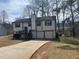 Charming two-story home with a double garage and driveway at 601 Brass Key Ct, Lawrenceville, GA 30046