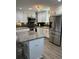 Modern kitchen with granite countertops, stainless steel appliances, and ample cabinet space at 601 Brass Key Ct, Lawrenceville, GA 30046
