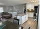 Open concept kitchen with island, stainless steel appliances and adjacent living space at 601 Brass Key Ct, Lawrenceville, GA 30046