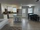 Spacious kitchen featuring modern appliances, island with seating, and adjacent dining area at 601 Brass Key Ct, Lawrenceville, GA 30046