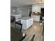 Modern kitchen with stainless steel appliances, island, and granite countertops at 601 Brass Key Ct, Lawrenceville, GA 30046