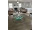 Inviting living room with a fireplace, comfortable seating, and a ceiling fan at 601 Brass Key Ct, Lawrenceville, GA 30046