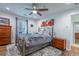 Cozy bedroom featuring natural light, a ceiling fan, and hardwood floors at 1901 Cumberland Ct, Smyrna, GA 30080