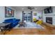 Open-concept living room with fireplace, hardwood floors, natural light, and stylish decor at 1901 Cumberland Ct, Smyrna, GA 30080