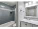 Inviting bathroom with stylish tile work, a shower and tub combo, and updated vanity at 2135 N Forest Trl, Dunwoody, GA 30338