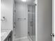 Modern bathroom with glass shower and updated vanity, offering a spa-like experience at 2135 N Forest Trl, Dunwoody, GA 30338