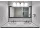 Bright bathroom featuring double sinks, stylish lighting, and modern countertops at 2135 N Forest Trl, Dunwoody, GA 30338