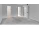 This bedroom has neutral carpet, multiple doorways, and two electrical outlets at 2135 N Forest Trl, Dunwoody, GA 30338