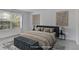 This bedroom features a king bed, lots of natural light, and decorative art at 2135 N Forest Trl, Dunwoody, GA 30338