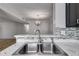Kitchen sink with stainless steel appliances and modern fixtures at 2135 N Forest Trl, Dunwoody, GA 30338
