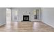 Living room featuring a fireplace, hardwood floors, and natural light at 2135 N Forest Trl, Dunwoody, GA 30338