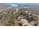 Desirable neighborhood aerial view featuring well-manicured lawns, mature trees and some homes with lake views at 6455 Quiet Cove Rd, Cumming, GA 30041