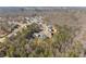 Aerial view of an established neighborhood showing large homes surrounded by mature trees at 6455 Quiet Cove Rd, Cumming, GA 30041